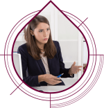 woman in office clothes holding pen